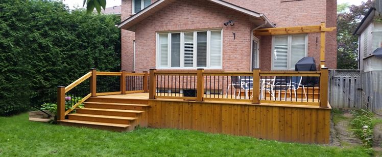Custom cedar deck by Total Landscaping Services